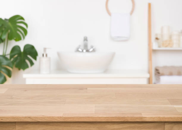 istock Wooden counter on blurred bathroom background, design key visual layout 1384258584