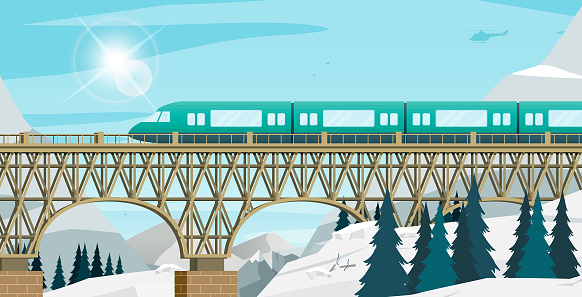 The train was running on a high bridge among the snowy mountains.