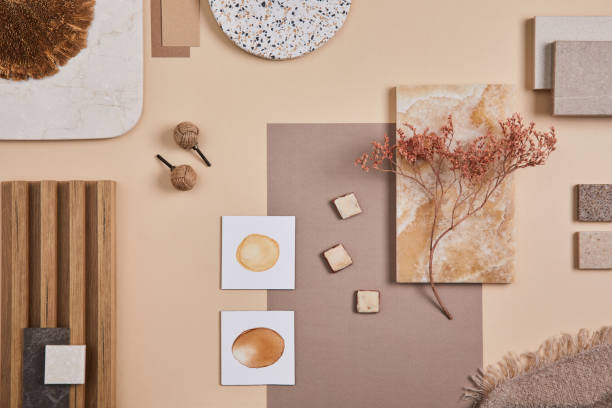 Flat lay of stylish architect moodboard composition with beige samples of textile, paint, wooden lamella panels and tiles. Top view. Copy space. Template. stock photo