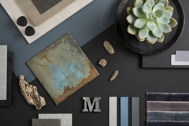 Creative flat lay composition with textile and paint samples, panels and tiles. Stylish interior designer moodboard. Black, blue, beige and dark grey color palette. Copy space. Template. "n stock photo