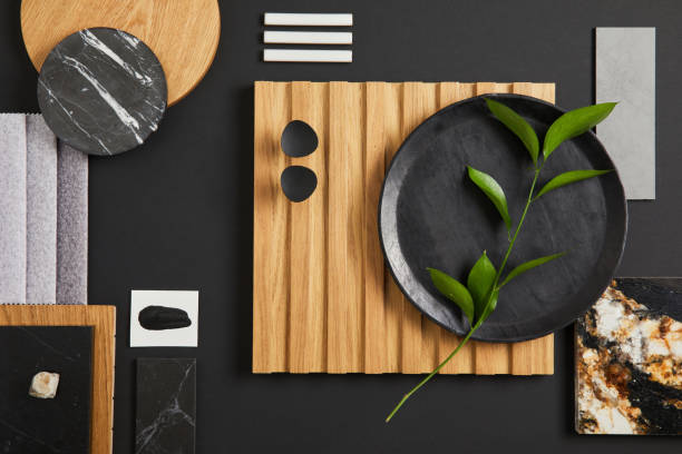 Stylish flat lay comosition of creative architect moodboard with black, beige and grey samples of textile, paint, wooden lamella panels and marble tiles. Top view. Copy space. Template."n stock photo