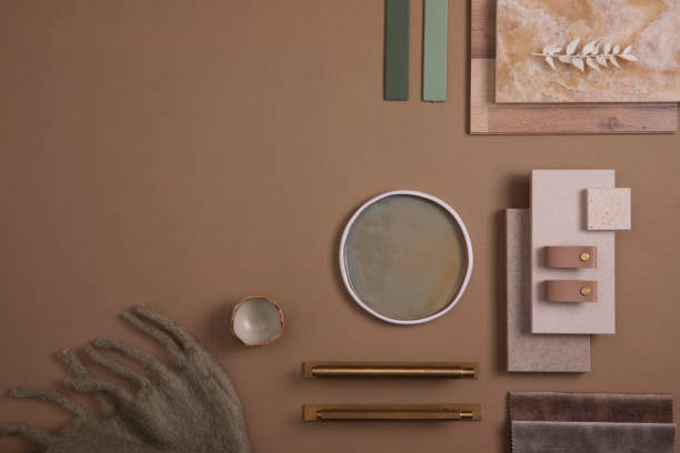 istock Creative flat lay composition of interior designer moodboard with textile and paint samples, panels and tiles. Beige, brown and green color palette. Copy space. Template. 1384259554