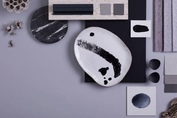 istock Creative flat lay composition in grey and black color palette with textile and paint samples, panels and tiles. Architect and interior designer moodboard. Top view. Copy space. Template. 1384259574