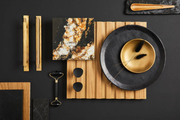 istock Stylish flat lay comosition of creative architect moodboard with samples of textile, paint, wooden lamella panel and marble tile. Golden, black and beige color palette. Copy space. Template. 1384259601