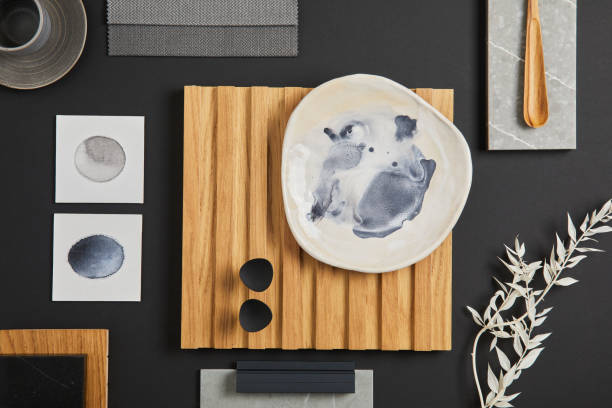 istock Elegant flat lay composition of interior designer moodboard with textile and paint samples, lamella panel and tiles. Black, beige and grey color palette. Copy space. Template.