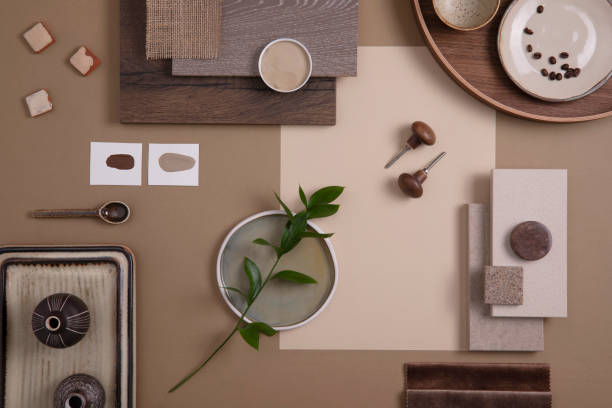 Flat lay of creative architect moodboard composition with samples of textile, paint, panels and tiles. Natural materials. Beige and brown color palette. Top view. Copy space. Template. stock photo