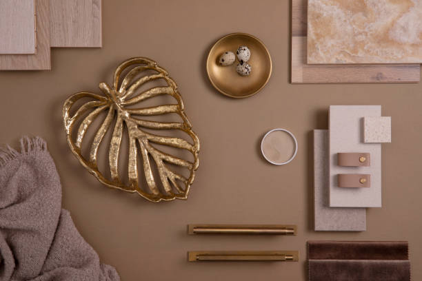 istock Creative flat lay composition with textile and paint samples, panels and tiles. Stylish interior designer moodboard. Golden and dark beige color palette. Copy space. Template. 1384259629