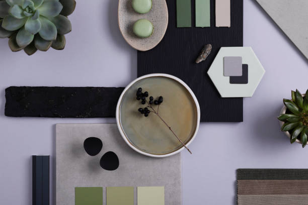 Stylish architect and interior designer moodboard. Flat lay composition in grey and green color palette with textile and paint samples, panels and tiles. Top view. Copy space. Template.
