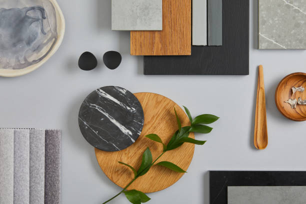 Elegant architect moodboard flat lay composition in light grey, black and brown color palette with textile and paint samples, wooden panels and marble tile. Top view. Copy space. Template. stock photo