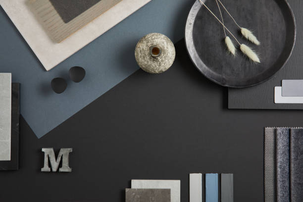 istock Elegant flat lay composition of interior designer moodboard with textile and paint samples, panels and tiles. Black, blue, beige and dark grey color palette. Copy space. Template. 1384259695