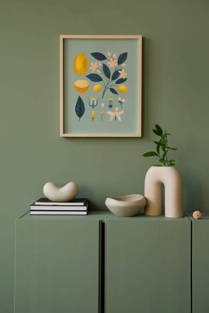 istock Modern living room interior composition with mockup poster frmae and modern home decorations and personal accessories on the eucalyptus wooden commode. Eucalyptus wall. Template. Copy space.