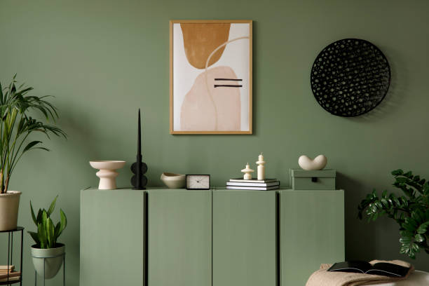 istock Modern living room interior composition with mockup poster frame, eucalyptus wooden commode, plants and modern home accessories. Eucalyptus wall. Home staging. Template. Copy space. 1384262007
