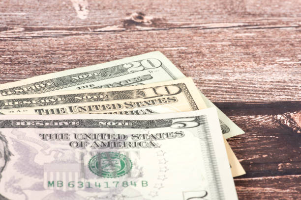 istock Close-up of various dollar banknotes 1384262022