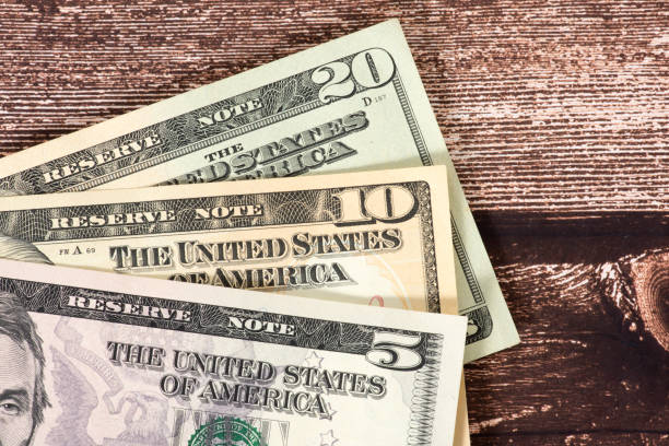istock Close-up of various dollar banknotes 1384262056