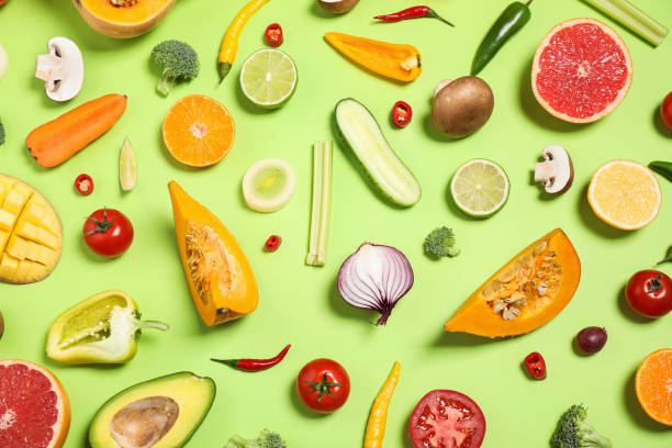 istock Flat lay composition with fresh organic fruits and vegetables on light green background 1384263078