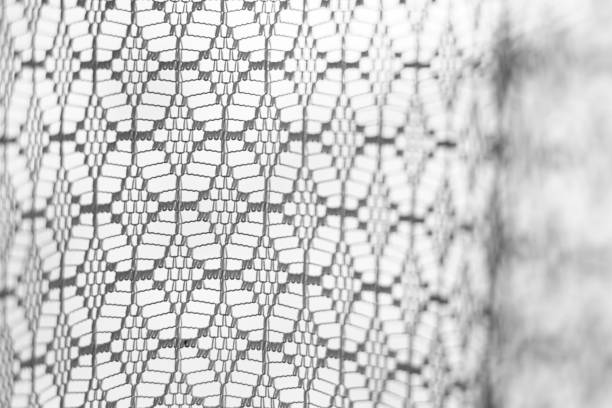 Close-up of an old tulle window.