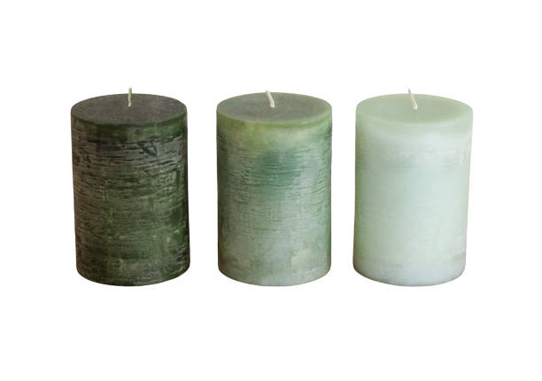 istock three green candles standing in a raw in white background 1384263427