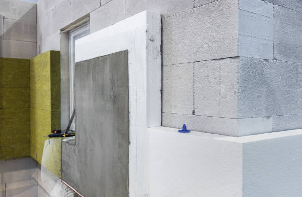 construction of a house and insulation of the wall of the house with layers stock photo