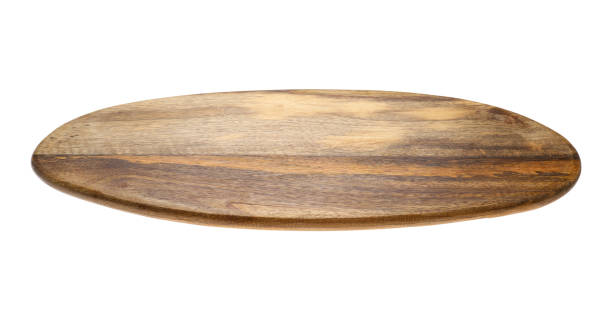istock New wooden board isolated on white. Cooking utensils 1384264200