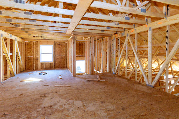 istock Fragment of a new home under construction wood framing beams 1384264480