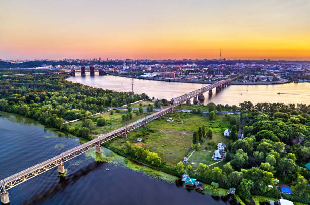istock Dnieper with Petrovsky Railway Bridge in Kiev, Ukraine 1384264704