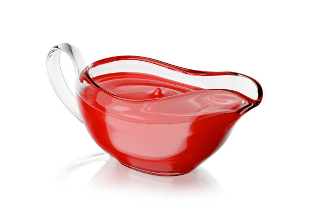 istock Sauce boat with ketchup isolated on white. 3D rendering. 1384267077