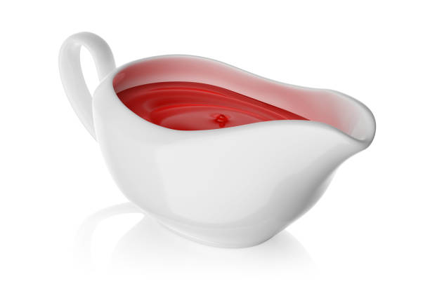 istock Sauce boat with ketchup isolated on white. 3D rendering. 1384267149