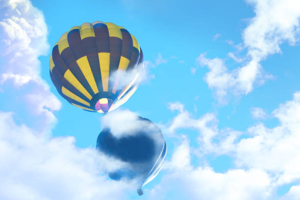 istock Fantastic dreams. Hot air balloons in blue sky with clouds 1384268174
