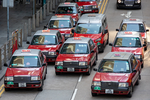 Hong Kong - March 10, 2022 : Taxis waiting for customers in Central, Hong Kong.