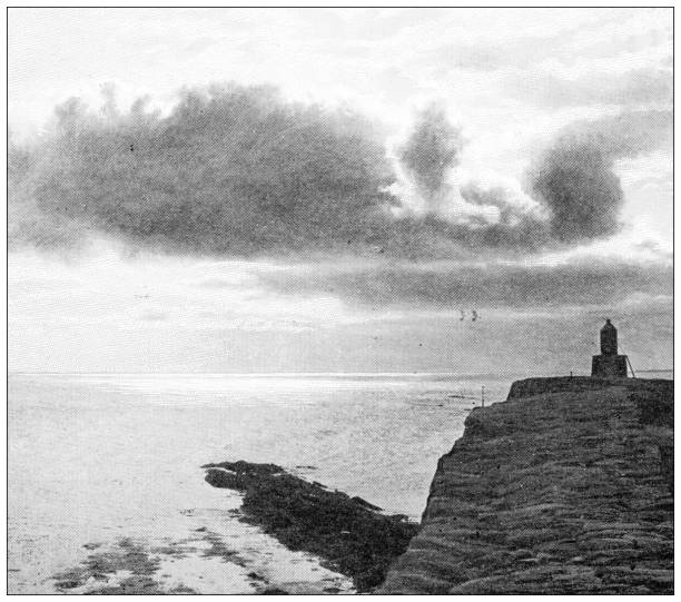 istock Antique travel photographs of England: Cornwall lighthouse 1384271400