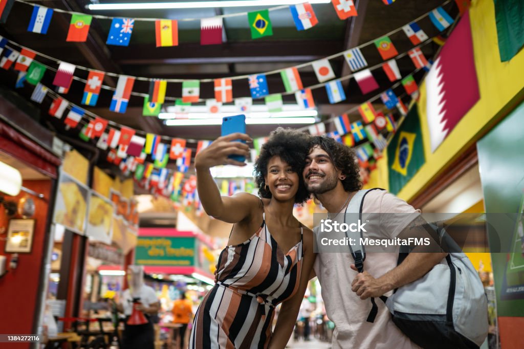Tourists taking a selfie Tourists taking a selfie at the Municipal Market of São Paulo, Brazil Travel Stock Photo