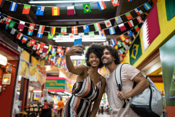 tourists taking a selfie - tourism imagens e fotografias de stock