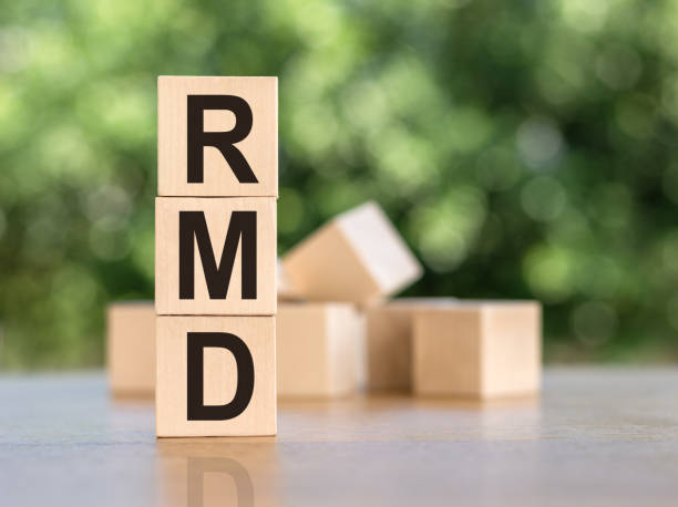 istock wooden blocks with words RMD required minimum distributions 1384272723