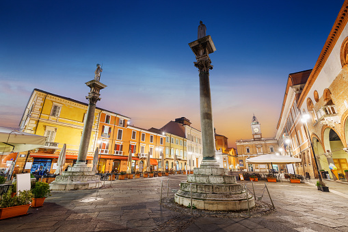 Ravenna, Italy at Piazza del Popolo and landmark towers at dusk.