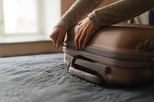 Woman packing a suitcase for a trip