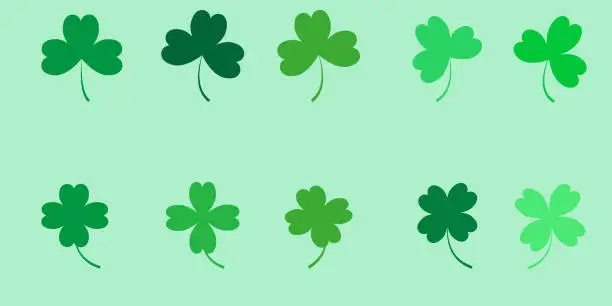 Vector illustration of Set of clovers of different shades of green, 3 and 4 leaf clovers