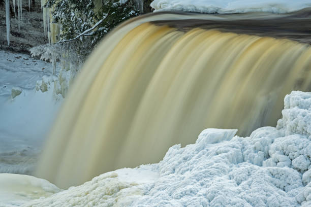 istock Winter Upper Tahquamenon Falls Framed by Snow and Ice 1384281052