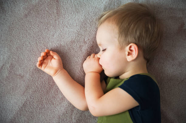 istock Toddler boy sleeping close-up. bedtime. Healthy sleep. 1384282152