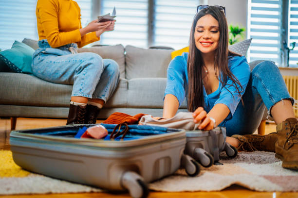 istock Young women preparing for a journey together 1384282229