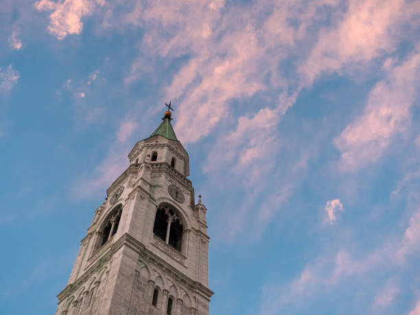 Campanile Bell Tower or Spire and Evening Sky in Cortina d'Ampezzo, Italy
