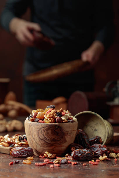 istock Various dried fruits and nuts on a kitchen table. 1384284968