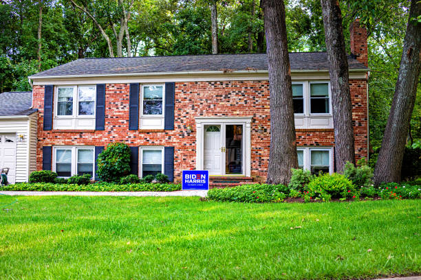 Presidential election political yard sign poster in support of Joe Biden 2020 text in northern Virginia suburbs with brick house exterior in neighborhood Sterling, USA - September 15, 2020: Presidential election political yard sign poster in support of Joe Biden 2020 text in northern Virginia suburbs with brick house exterior in neighborhood herndon virginia stock pictures, royalty-free photos & images