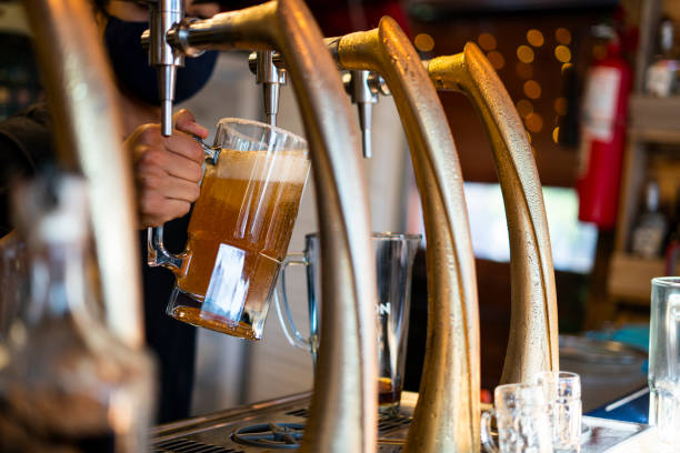 istock man who works in small drink business serves beers 1384285973