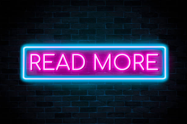 istock Read More neon banner, light signboard. 1384286017