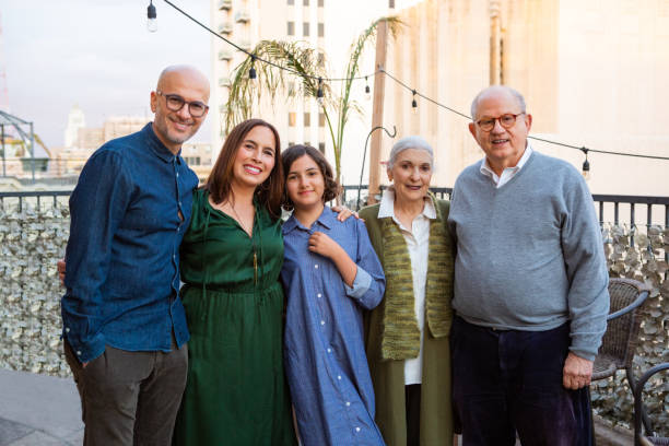 istock Three Generation Family Smiling on Balcony 1384288189