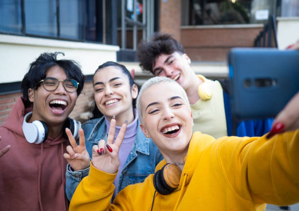 istock Group of multi-ethnic friends taking a selfie and having fun 1384289252
