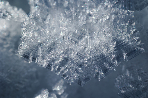 extreme macro view of beautiful real white an dark blue ice crystals
