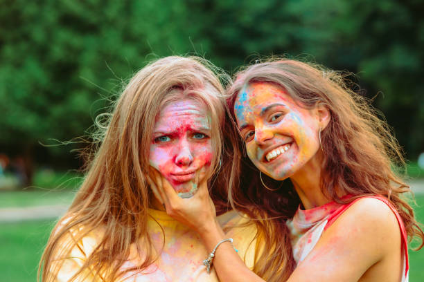 istock two women girlfriends having fun at holi fest 1384297988