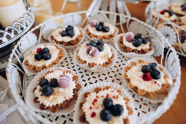 istock Delicious sweets on wedding candy buffet with desserts. Catering service 1384311877