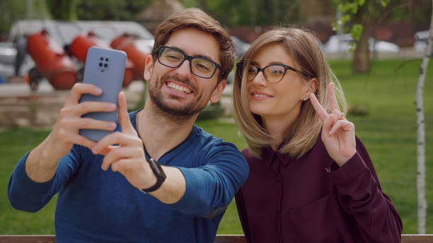 istock Wearing glasses take selfie with phone 1384312831